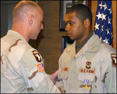 Pvt. Dwayne Turner receives the Silver Star from Brig. Gen. Frank Helmick, assistant deputy chief of Staff (Operations), 101st Airborne Division (Air Assault).